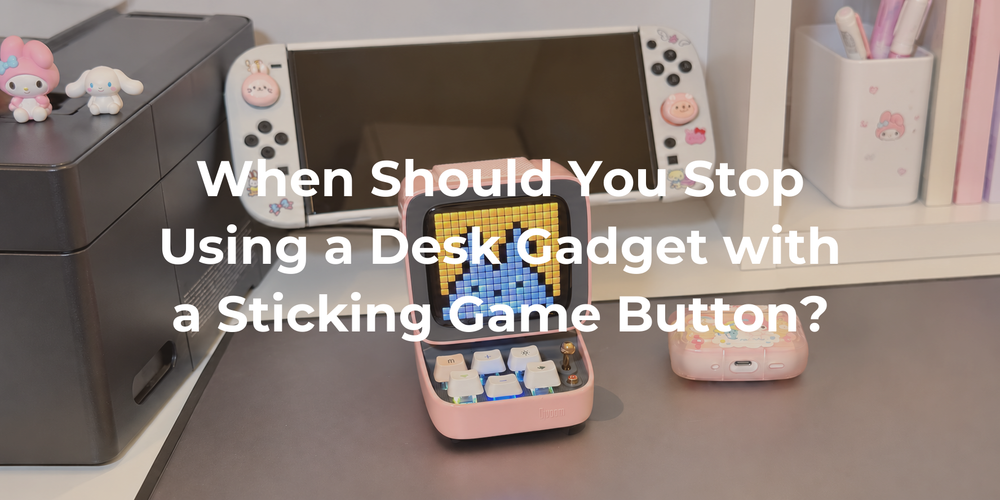 A pink retro pixel speaker with one lowered key on the supplied gaming desk.