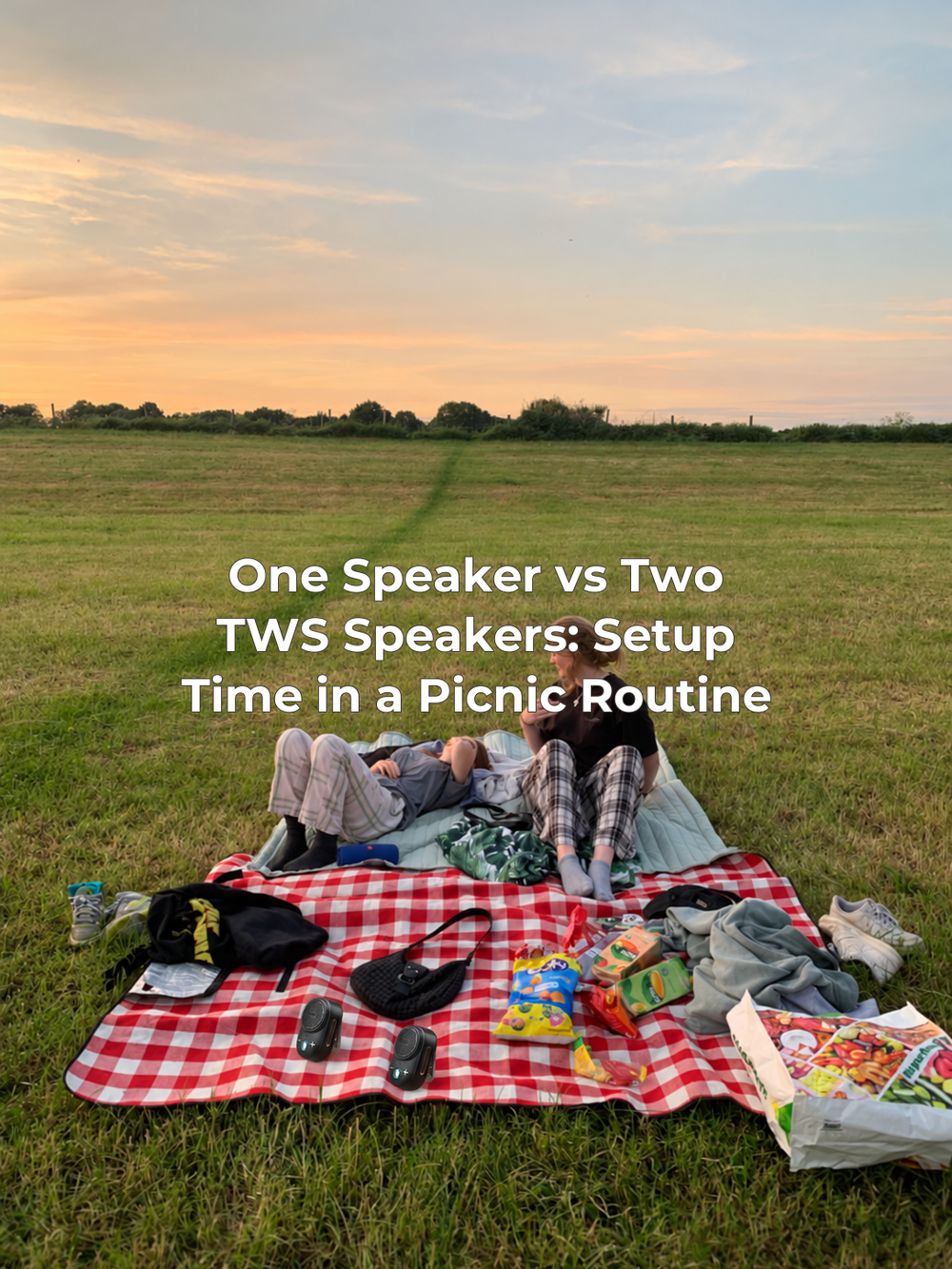 The supplied sunset picnic photograph with two small black Itour-S speakers added and the article title centered.