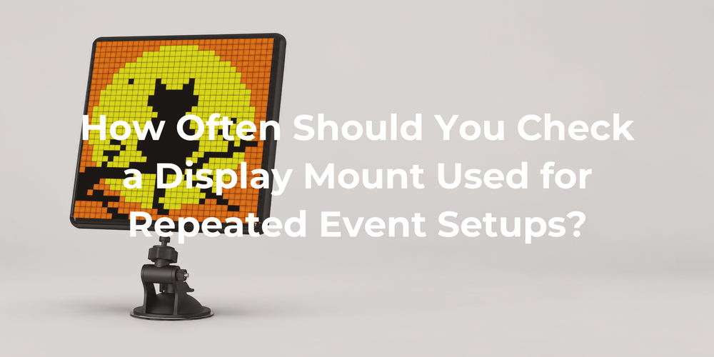 A black pixel display on its pictured articulated mount and round base.