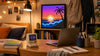 Divoom MiniToo and Pixoo-64 on a college dorm desk with pixel art display, back-to-school roommate gift scene
