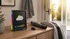 Divoom Times Frame weather display beside an umbrella keys and jacket for a morning commute