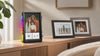 Divoom Times Frame in front of two conventional digital photo frames