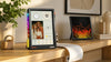 Divoom Times Frame and Pixoo-64 on a bright home shelf with a single receipt
