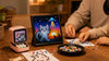 Family hands creating pixel art beside Divoom Pixoo-64 and Ditoo-Pro