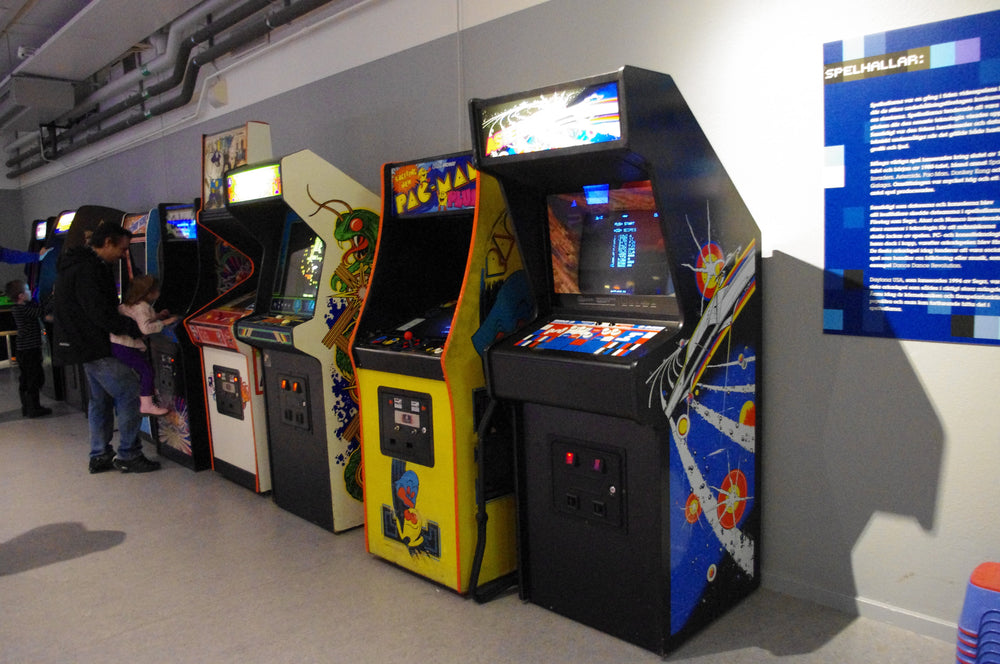 Classic arcade cabinets illustrating the history of iconic pixel video games, photograph by Staffan Vilcans