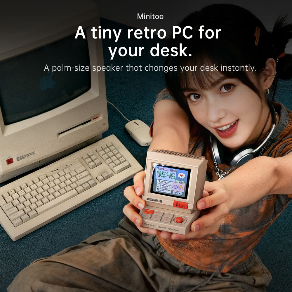 MiniToo held next to a retro desktop computer